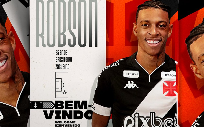 Vasco anuncia contratação de Robson Bambu. O zagueiro aparece na foto vestindo a camisa do time e, ao lado, há uma mensagem de boas-vindas.